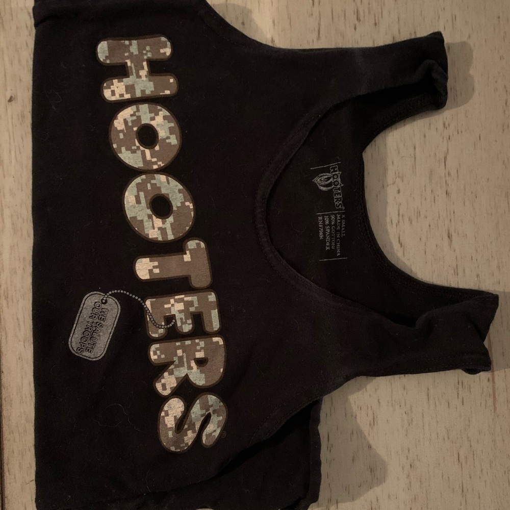 Hooters uniform top with black shorts